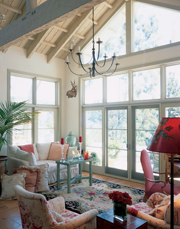 Gabled roofs allow for high windows that bathe the living room in California sunshine.